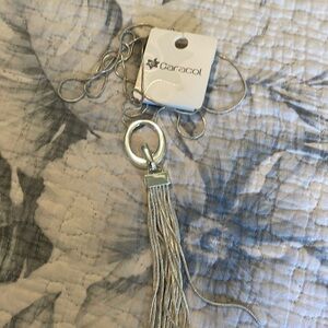 New necklace.  Silver with ring and accent